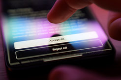 Finger hovers over Smartphone screen